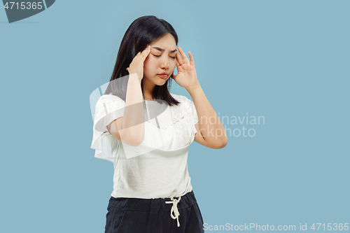 Image of Korean young woman\'s half-length portrait on blue background