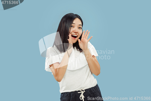 Image of Korean young woman\'s half-length portrait on blue background