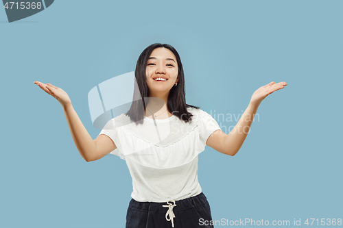 Image of Korean young woman\'s half-length portrait on blue background