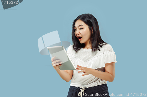 Image of Korean young woman\'s half-length portrait on blue background