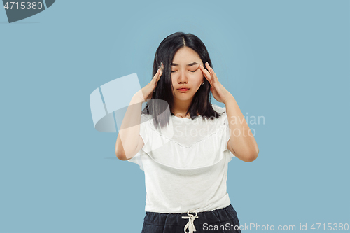 Image of Korean young woman\'s half-length portrait on blue background