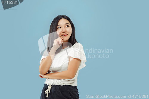 Image of Korean young woman\'s half-length portrait on blue background