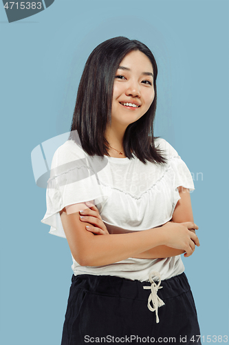 Image of Korean young woman\'s half-length portrait on blue background