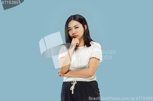 Image of Korean young woman\'s half-length portrait on blue background