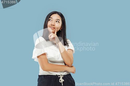 Image of Korean young woman\'s half-length portrait on blue background