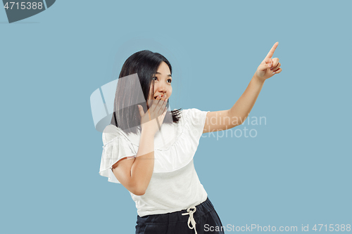 Image of Korean young woman\'s half-length portrait on blue background