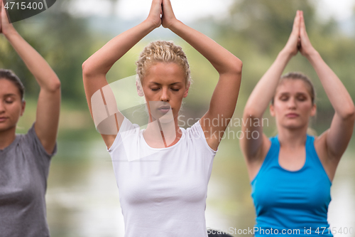 Image of women meditating and doing yoga exercise