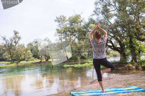 Image of woman meditating and doing yoga exercise