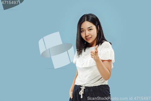 Image of Korean young woman\'s half-length portrait on blue background