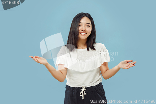 Image of Korean young woman\'s half-length portrait on blue background