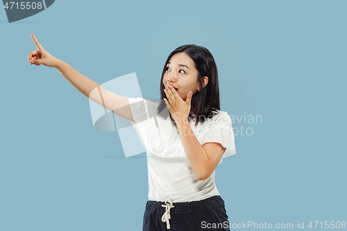 Image of Korean young woman\'s half-length portrait on blue background