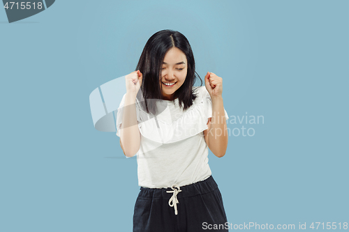 Image of Korean young woman\'s half-length portrait on blue background