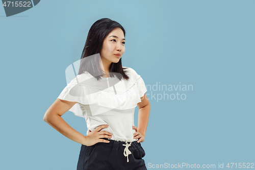 Image of Korean young woman\'s half-length portrait on blue background