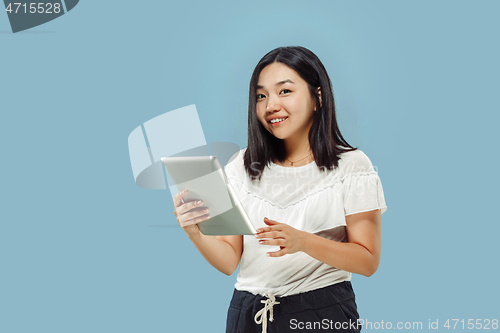 Image of Korean young woman\'s half-length portrait on blue background