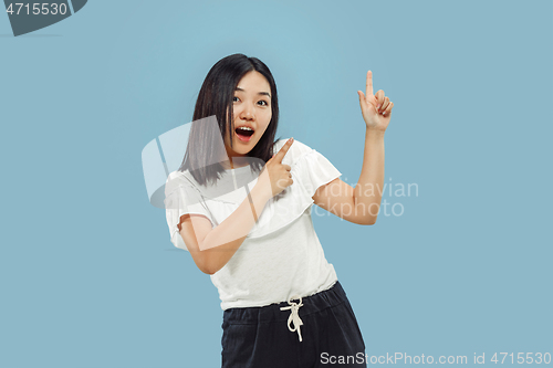 Image of Korean young woman\'s half-length portrait on blue background