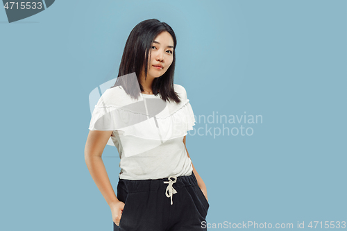 Image of Korean young woman\'s half-length portrait on blue background