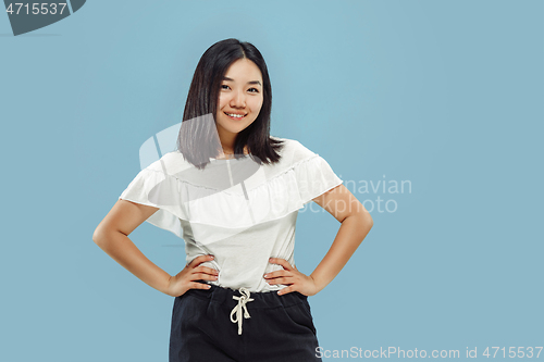 Image of Korean young woman\'s half-length portrait on blue background