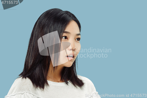 Image of Korean young woman\'s half-length portrait on blue background