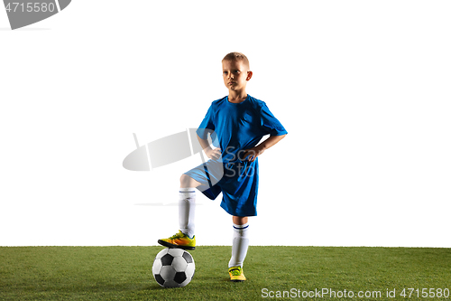 Image of Young boy as a soccer or football player on white studio background