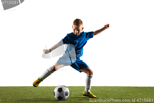 Image of Young boy as a soccer or football player on white studio background