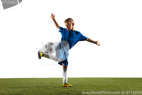 Image of Young boy as a soccer or football player on white studio background