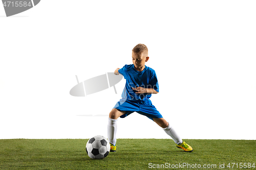 Image of Young boy as a soccer or football player on white studio background