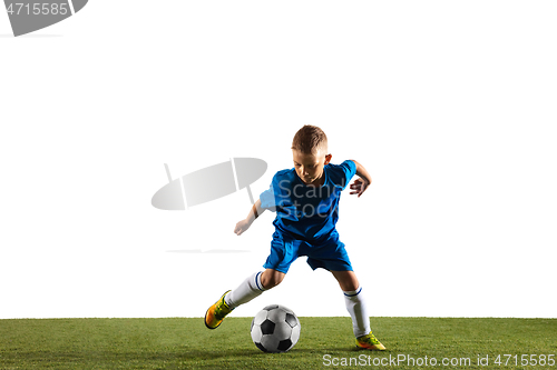 Image of Young boy as a soccer or football player on white studio background