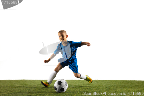 Image of Young boy as a soccer or football player on white studio background