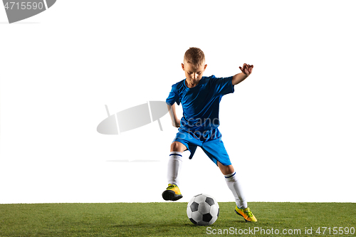 Image of Young boy as a soccer or football player on white studio background