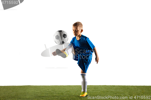 Image of Young boy as a soccer or football player on white studio background