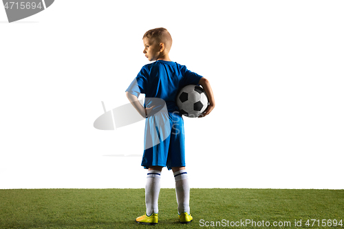 Image of Young boy as a soccer or football player on white studio background