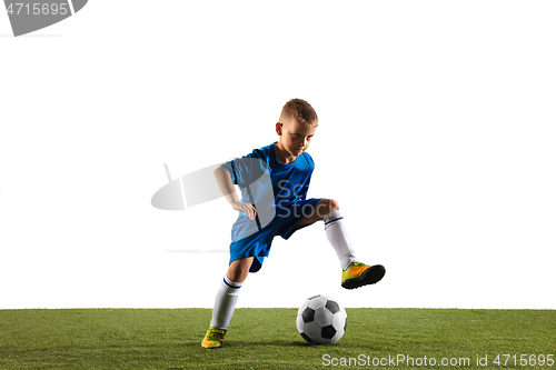 Image of Young boy as a soccer or football player on white studio background