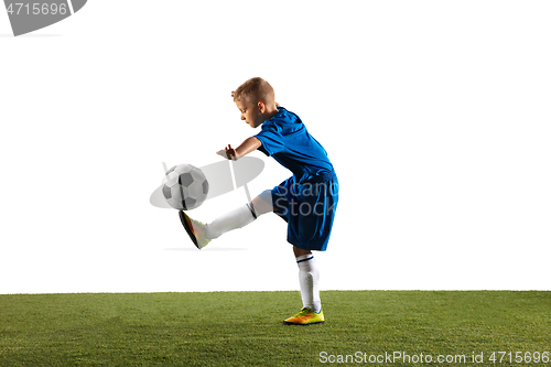 Image of Young boy as a soccer or football player on white studio background