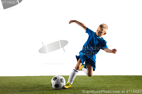 Image of Young boy as a soccer or football player on white studio background