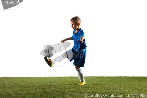 Image of Young boy as a soccer or football player on white studio background