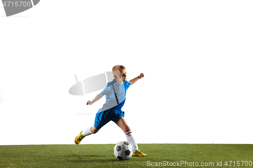 Image of Young boy as a soccer or football player on white studio background