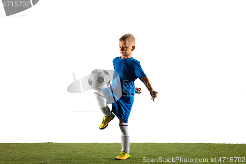 Image of Young boy as a soccer or football player on white studio background