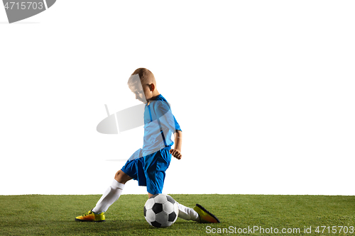 Image of Young boy as a soccer or football player on white studio background