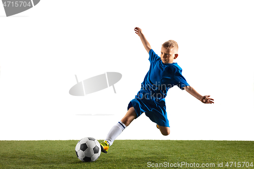 Image of Young boy as a soccer or football player on white studio background