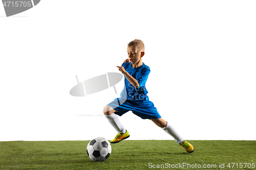 Image of Young boy as a soccer or football player on white studio background