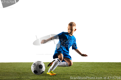 Image of Young boy as a soccer or football player on white studio background