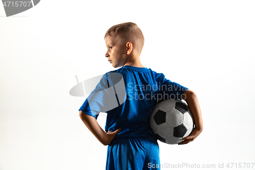 Image of Young boy as a soccer or football player on white studio background
