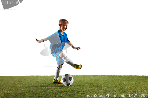 Image of Young boy as a soccer or football player on white studio background