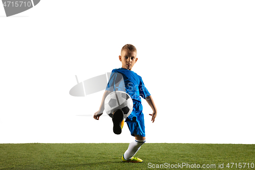 Image of Young boy as a soccer or football player on white studio background