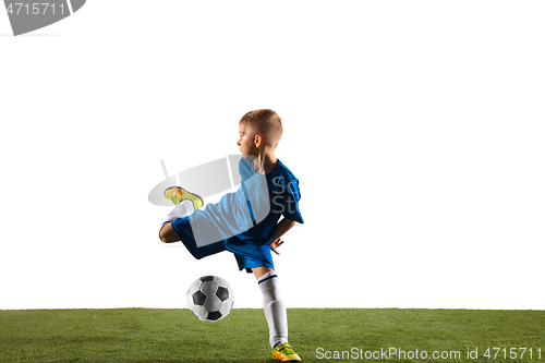 Image of Young boy as a soccer or football player on white studio background