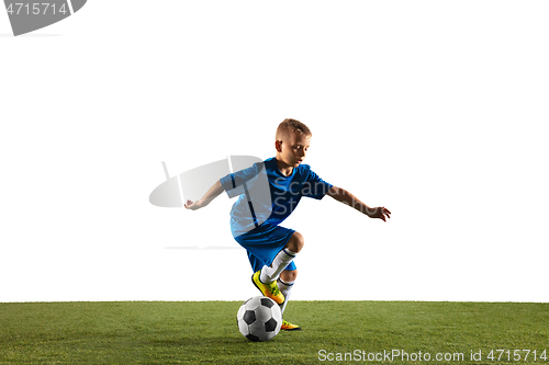 Image of Young boy as a soccer or football player on white studio background