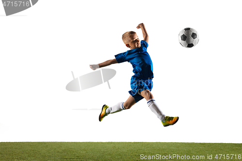 Image of Young boy as a soccer or football player on white studio background