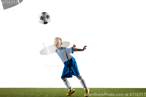 Image of Young boy as a soccer or football player on white studio background