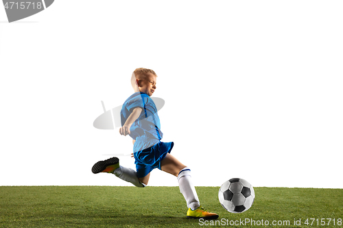 Image of Young boy as a soccer or football player on white studio background