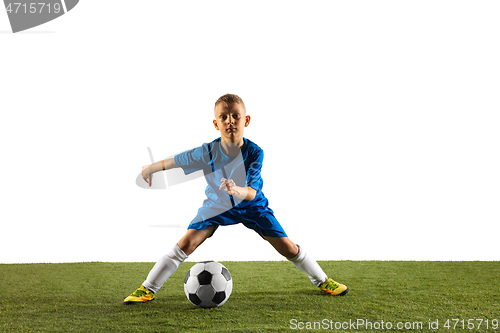 Image of Young boy as a soccer or football player on white studio background